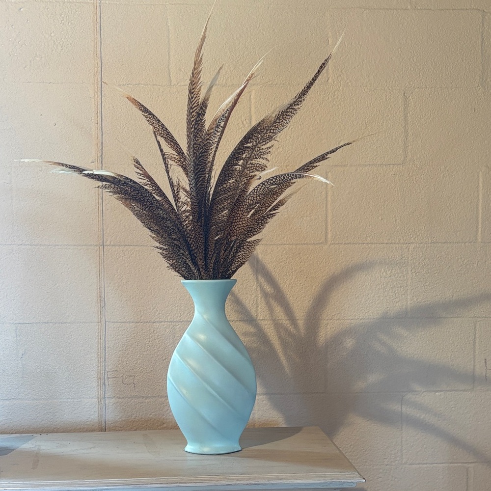 Elegant Blue Vase with Decorative Feathers